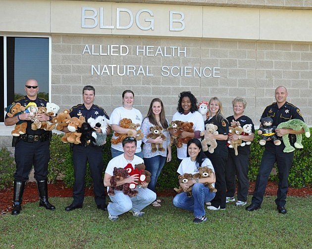 3.8x10 Photo of Bossier Sheriff's Deputies and BPCC nursing students pose with stuffed toys.